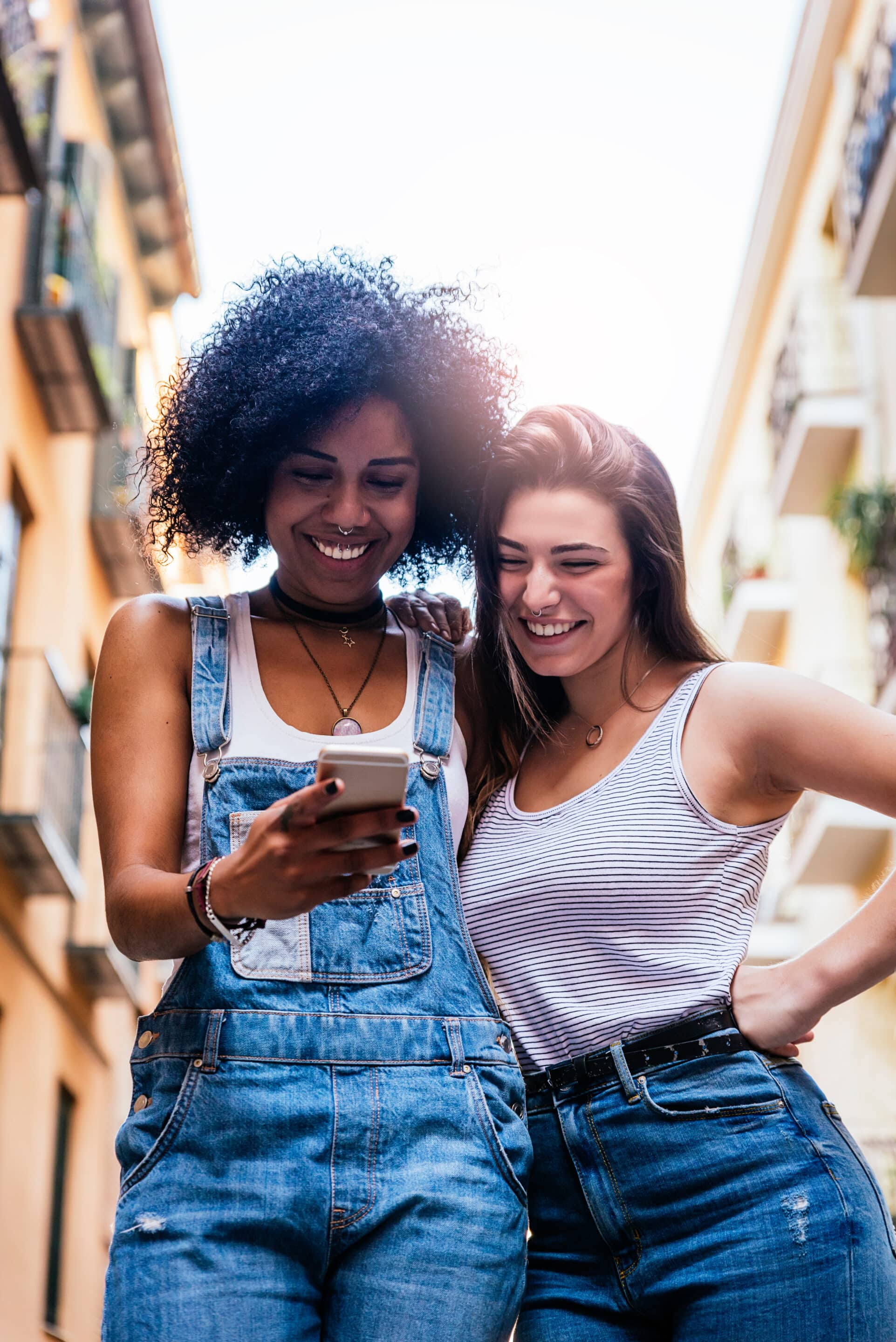 Beautiful women using a mobile in the Street.